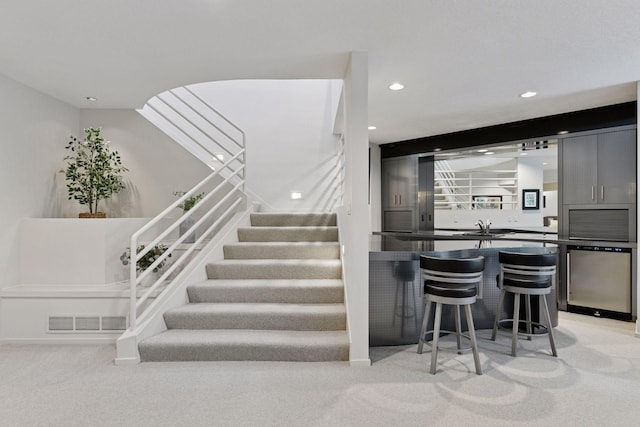 3490 Fairway Ln, Minnetonka, MN 55305 - staircase with carpet flooring, wet bar, and recessed lighting