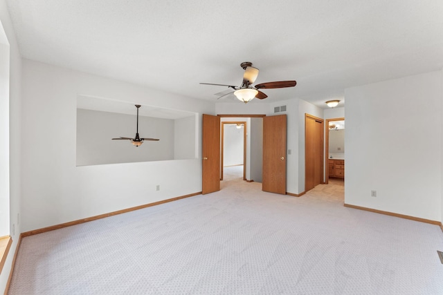 18504 Peach Tree Ct, Minnetonka, MN 55345 - empty room with a ceiling fan, light carpet, and baseboards