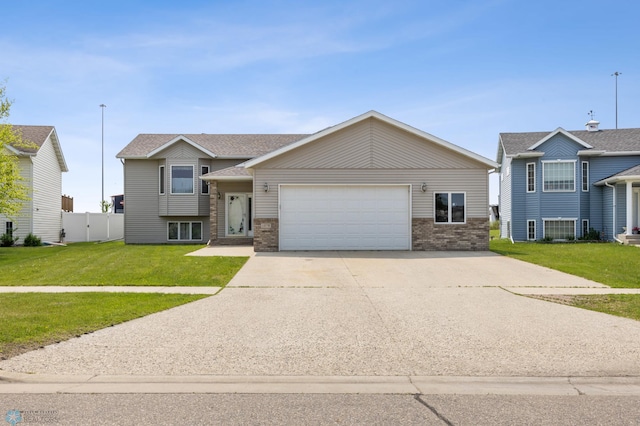 1878 10th St W, West Fargo, ND 58078 - view of front of home with a garage, brick siding, and concrete driveway