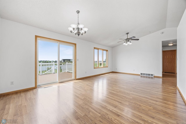 1878 10th St W, West Fargo, ND 58078 - empty room with vaulted ceiling, a chandelier, light wood-style floors, baseboards, and a ceiling fan