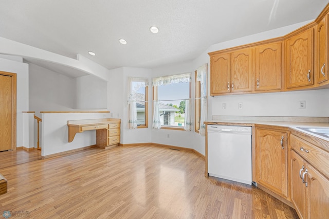 1878 10th St W, West Fargo, ND 58078 - kitchen with dishwasher, recessed lighting, light countertops, light wood-style flooring, and baseboards