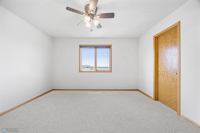 1878 10th St W, West Fargo, ND 58078 - unfurnished bedroom featuring light carpet, baseboards, a textured ceiling, and ceiling fan