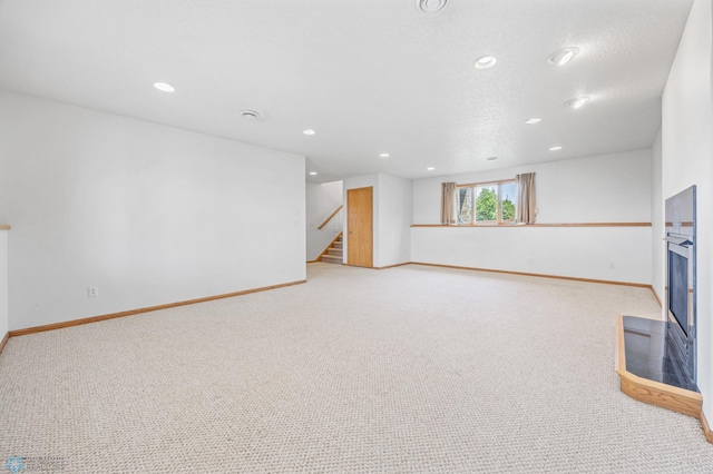 1878 10th St W, West Fargo, ND 58078 - basement featuring light colored carpet, baseboards, stairway, and recessed lighting