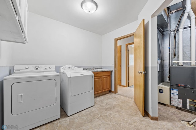 1878 10th St W, West Fargo, ND 58078 - washroom featuring washing machine and dryer and cabinet space