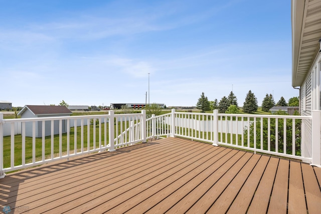 1878 10th St W, West Fargo, ND 58078 - wooden terrace featuring a lawn and an outdoor structure