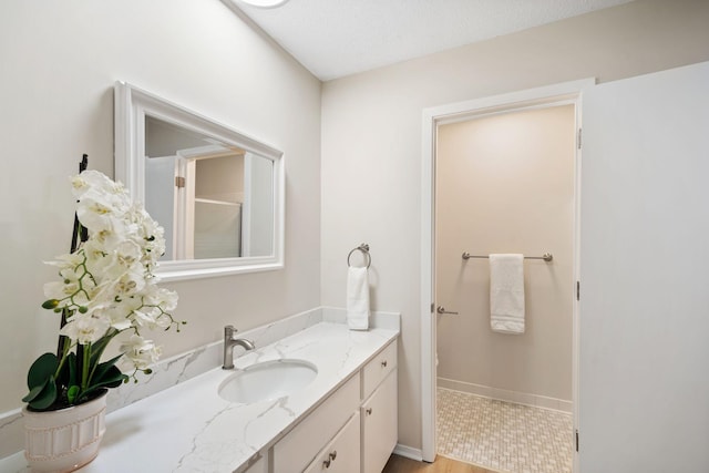 7510 Cahill Rd Unit 103B, Edina, MN 55439 - full bath with vanity and baseboards