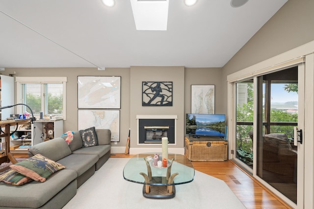 475 Lakeview Ave, Tonka Bay, MN 55331 - living room with light wood-style floors, a glass covered fireplace, recessed lighting, and lofted ceiling