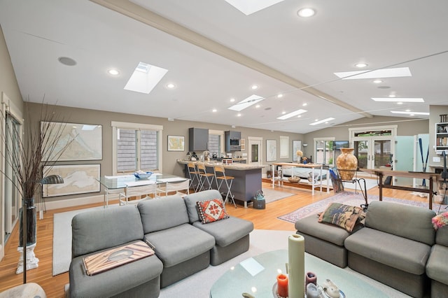 475 Lakeview Ave, Tonka Bay, MN 55331 - living area with a skylight, lofted ceiling, light wood finished floors, and recessed lighting