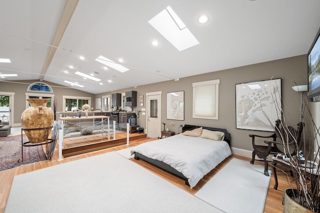 475 Lakeview Ave, Tonka Bay, MN 55331 - bedroom with a skylight, light wood-type flooring, vaulted ceiling, and recessed lighting