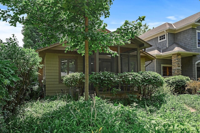 475 Lakeview Ave, Tonka Bay, MN 55331 - view of side of property featuring a sunroom and roof with shingles