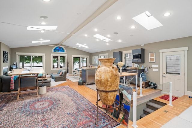 475 Lakeview Ave, Tonka Bay, MN 55331 - living area featuring a skylight, lofted ceiling, light wood-style flooring, and recessed lighting