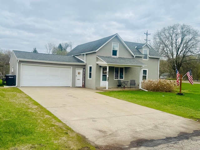 802 5th St NE, Little Falls, MN 56345 - traditional-style home featuring stucco siding, a front yard, driveway, a garage, and roof with shingles