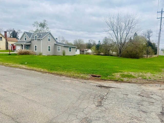 802 5th St NE, Little Falls, MN 56345 - view of side of property featuring stucco siding