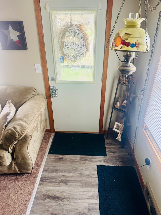 802 5th St NE, Little Falls, MN 56345 - doorway to outside featuring wood finished floors