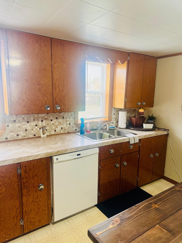 802 5th St NE, Little Falls, MN 56345 - kitchen with white dishwasher, a sink, and light countertops