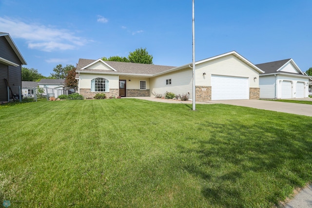 509 32nd St N, Moorhead, MN 56560 - single story home featuring concrete driveway, an attached garage, a front lawn, stone siding, and roof with shingles