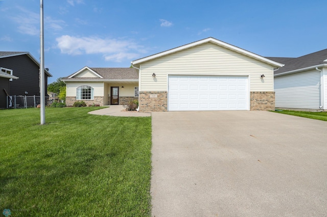 509 32nd St N, Moorhead, MN 56560 - view of front of property with brick siding, concrete driveway, and a garage