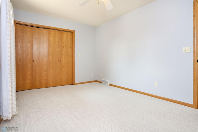 509 32nd St N, Moorhead, MN 56560 - unfurnished bedroom with carpet flooring, a closet, baseboards, and a ceiling fan