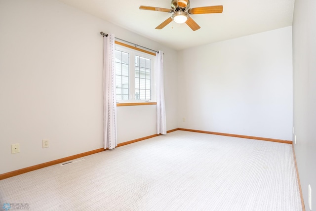509 32nd St N, Moorhead, MN 56560 - carpeted empty room with a ceiling fan and baseboards