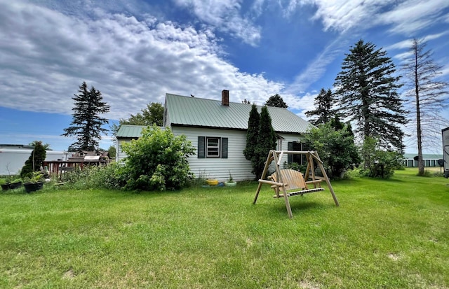 49892 285th Ave, Staples, MN 56479 - rear view of property featuring a chimney, metal roof, and a lawn