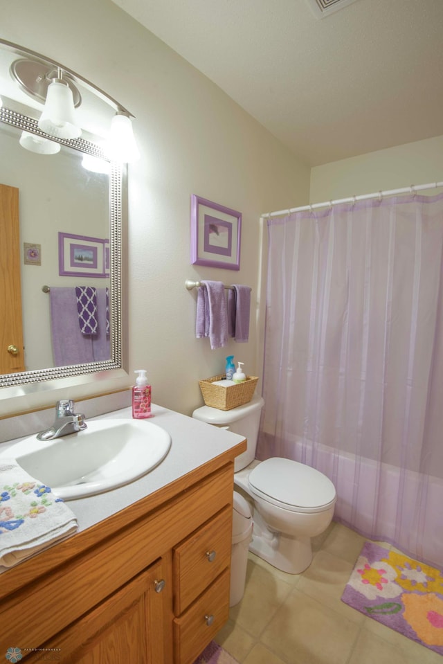 1010 4th Ave NE, Dilworth, MN 56529 - full bath featuring toilet, vanity, curtained shower, and tile patterned flooring