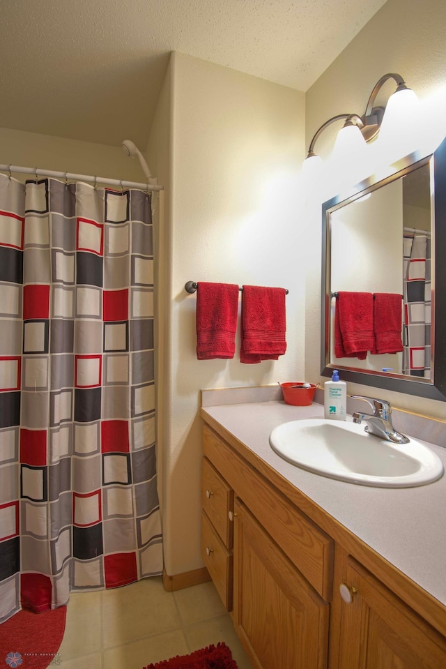 1010 4th Ave NE, Dilworth, MN 56529 - bathroom with vanity, tile patterned floors, a textured ceiling, and a shower with shower curtain