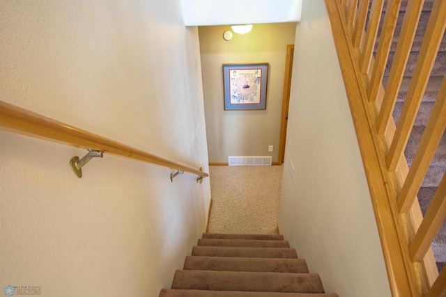 1010 4th Ave NE, Dilworth, MN 56529 - stairway featuring carpet flooring
