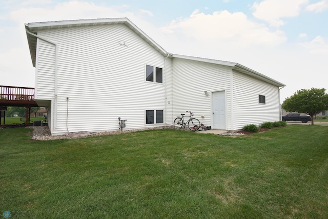 1010 4th Ave NE, Dilworth, MN 56529 - rear view of property with a lawn and a deck