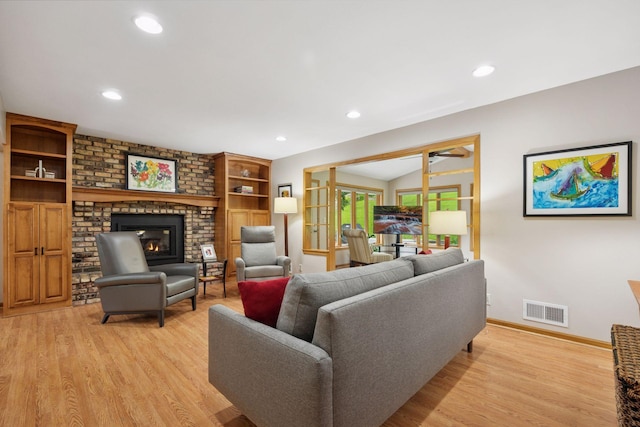 3933 Dartmouth Dr, Minnetonka, MN 55345 - living area featuring a fireplace, light wood-type flooring, baseboards, recessed lighting, and a ceiling fan
