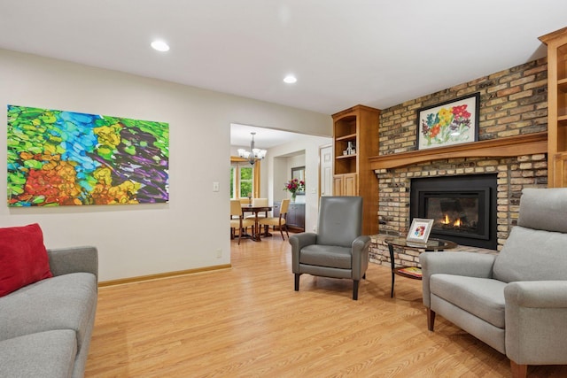 3933 Dartmouth Dr, Minnetonka, MN 55345 - living area featuring a chandelier, light wood-type flooring, baseboards, a fireplace, and recessed lighting
