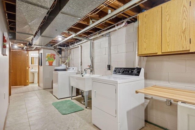 3933 Dartmouth Dr, Minnetonka, MN 55345 - laundry area featuring separate washer and dryer and cabinet space