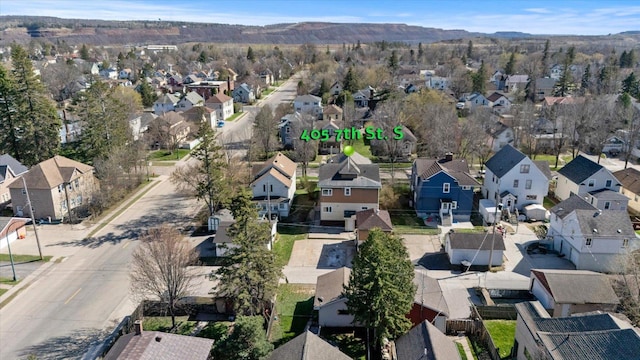 405 7th St S, Virginia, MN 55792 - aerial view of property and surrounding area featuring nearby suburban area and mountains