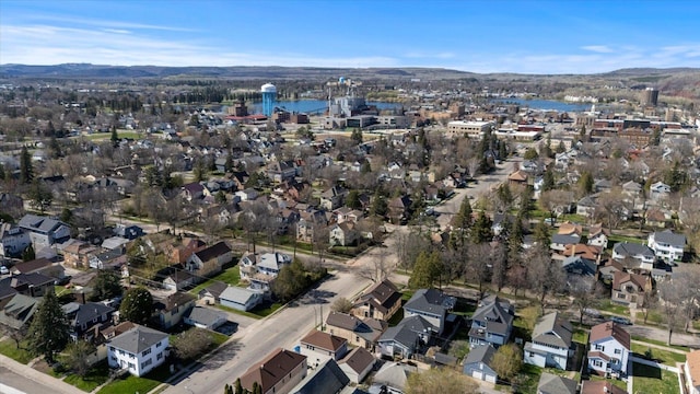 405 7th St S, Virginia, MN 55792 - aerial view of property's location with nearby suburban area and a water and mountain view