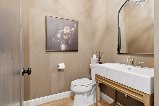 1432 25th St, Saint Joseph Twp, WI 54082 - half bathroom with toilet, baseboards, and vanity