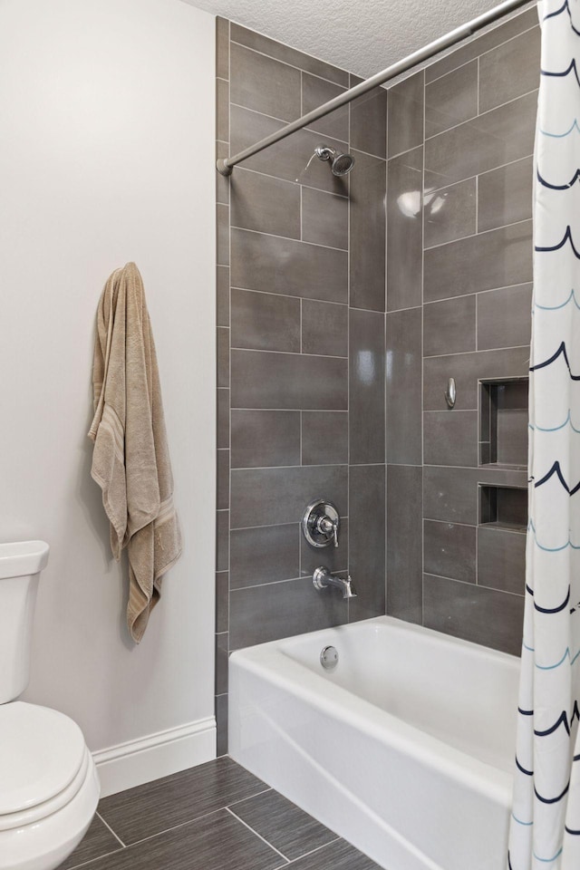 1432 25th St, Saint Joseph Twp, WI 54082 - full bathroom featuring baseboards, toilet, shower / bath combination with curtain, and a textured ceiling