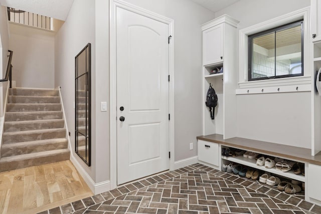 1432 25th St, Saint Joseph Twp, WI 54082 - mudroom featuring baseboards and brick patterned flooring