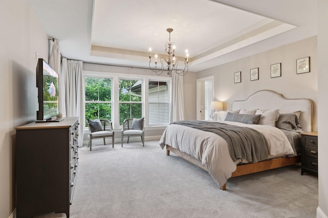 1432 25th St, Saint Joseph Twp, WI 54082 - bedroom with a tray ceiling, a chandelier, and light colored carpet