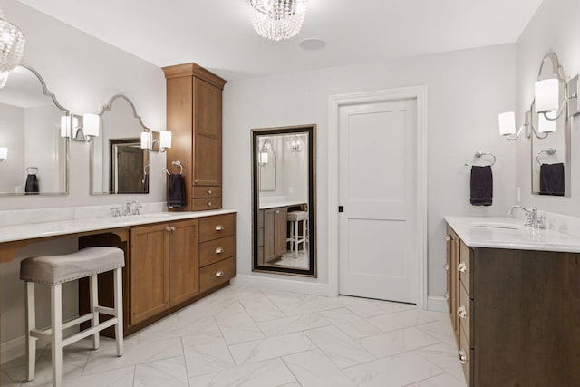 1432 25th St, Saint Joseph Twp, WI 54082 - bathroom featuring a chandelier, two vanities, and marble finish flooring