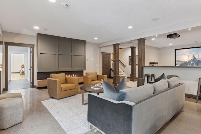 1432 25th St, Saint Joseph Twp, WI 54082 - living area featuring decorative columns and recessed lighting