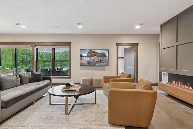1432 25th St, Saint Joseph Twp, WI 54082 - living area with recessed lighting, a lit fireplace, and a textured ceiling