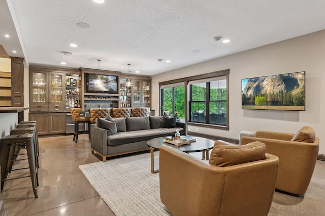 1432 25th St, Saint Joseph Twp, WI 54082 - living room with finished concrete flooring, a textured ceiling, recessed lighting, and baseboards
