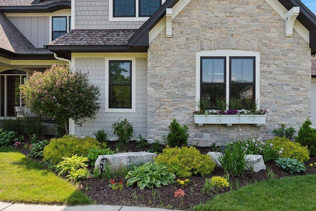 1432 25th St, Saint Joseph Twp, WI 54082 - view of side of property featuring stone siding and a shingled roof