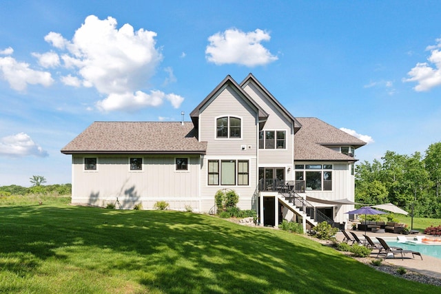 1432 25th St, Saint Joseph Twp, WI 54082 - rear view of property featuring stairway, a deck, a lawn, and a patio