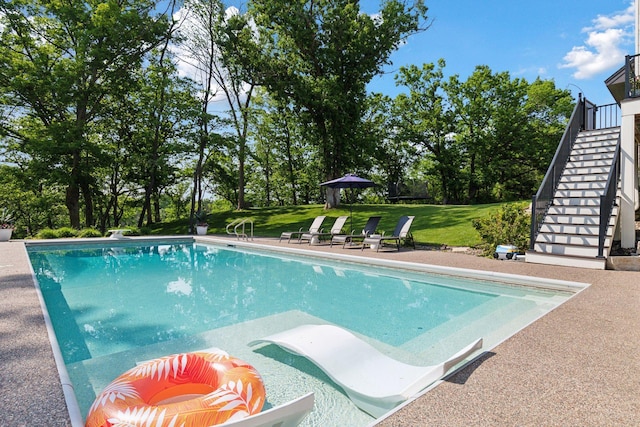 1432 25th St, Saint Joseph Twp, WI 54082 - swimming pool featuring stairway, a yard, and view of scattered trees