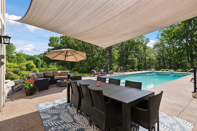 1432 25th St, Saint Joseph Twp, WI 54082 - swimming pool featuring a patio, an outdoor hangout area, a diving board, outdoor dining area, and view of scattered trees