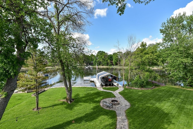 1665 Canary Ln, Mound, MN 55364 - dock with boat lift, a water view, a yard, and an outdoor fire pit