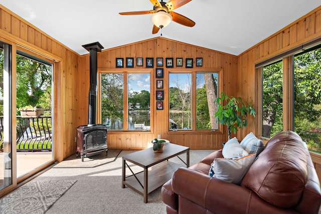 1665 Canary Ln, Mound, MN 55364 - sunroom with a wood stove, vaulted ceiling, healthy amount of natural light, and a water view