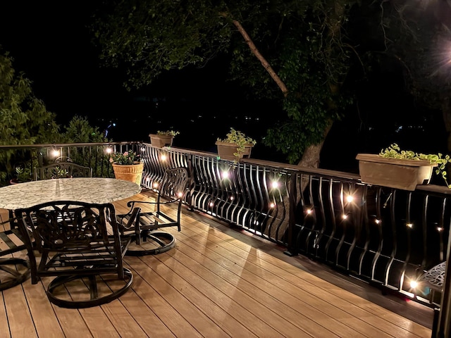 1665 Canary Ln, Mound, MN 55364 - deck at night with outdoor dining area