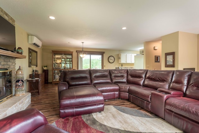 23725 240th Ave, Aurdal Twp, MN 56537 - living room with a wall mounted AC, wood finished floors, recessed lighting, and a fireplace