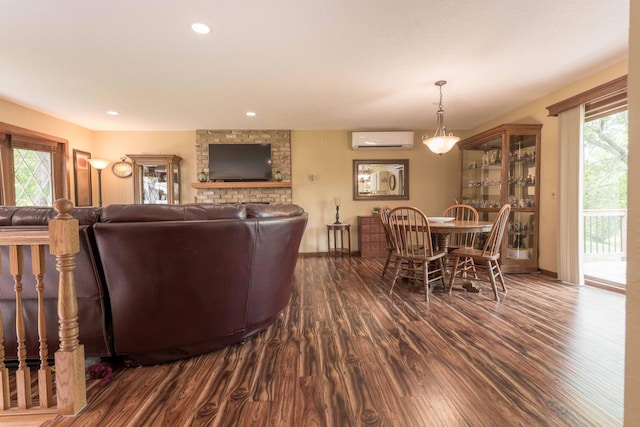 23725 240th Ave, Aurdal Twp, MN 56537 - living room with a wall mounted AC, dark wood-type flooring, baseboards, and recessed lighting